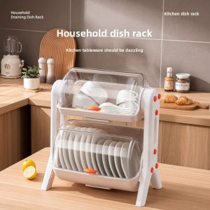 Kệ úp chén bát 2 tầng màu trắng, đặt trong bếp, có nắp đậy trong suốt.