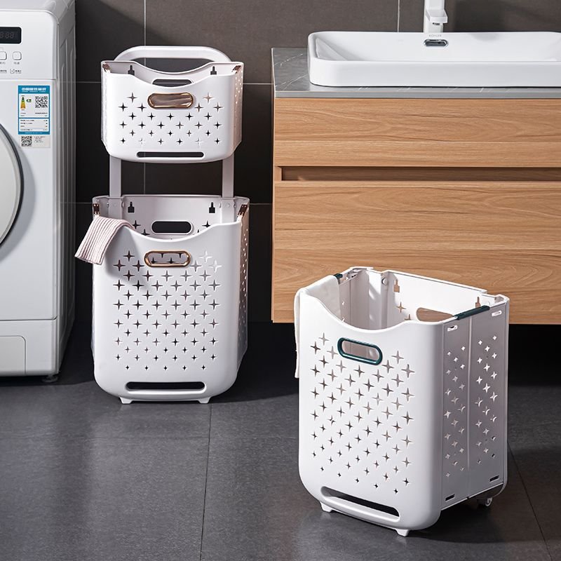 Giỏ đựng quần áo hai tầng nhựa PP có bánh xe gấp gọn tiện lợi Giỏ đựng quần áo hai tầng đặt trong phòng tắm, thiết kế hiện đại.