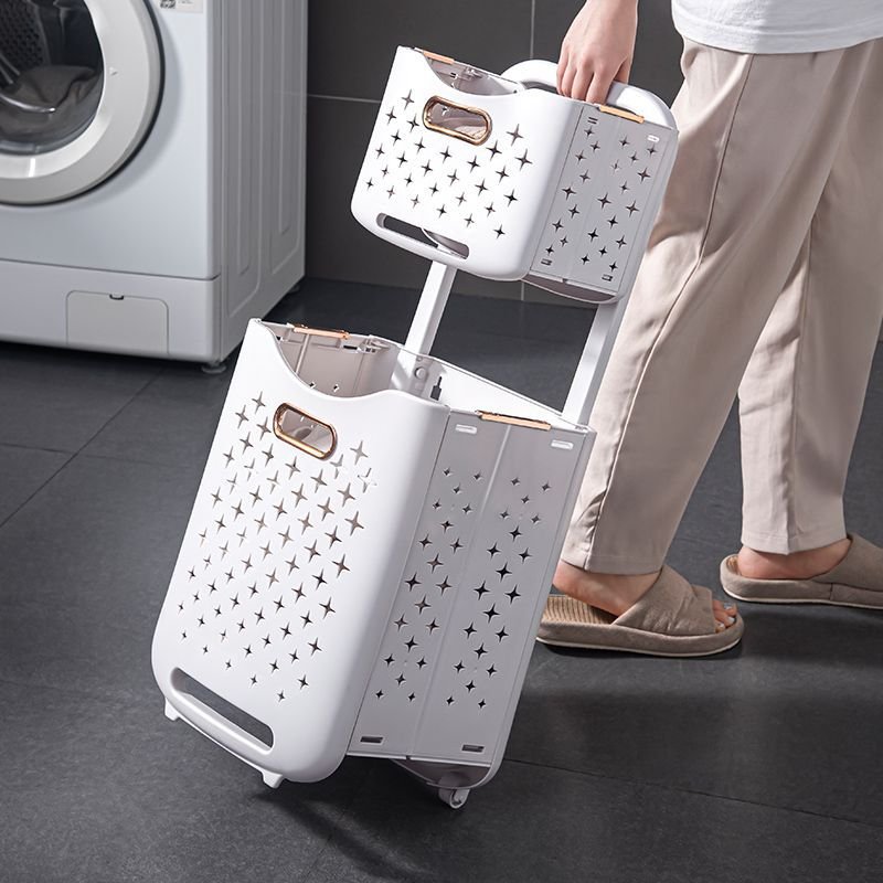 Giỏ đựng quần áo hai tầng nhựa PP có bánh xe gấp gọn tiện lợi Người dùng kéo giỏ quần áo có bánh xe, dễ dàng di chuyển.