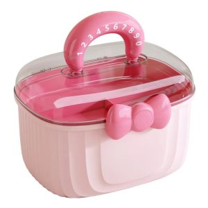 Hộp nhựa đa năng dung tích lớn đựng trang sức, mỹ phẩm cho bé gái Hộp đựng màu hồng nhạt, nắp trong suốt, có tay cầm và nơ trang trí phía trước.