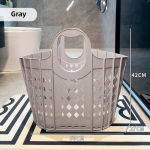 Giỏ đựng quần áo nhựa PP gấp gọn dung tích lớn có tay cầm Giỏ màu xám, kích thước lớn 50x27x42cm, đặt trong phòng tắm.